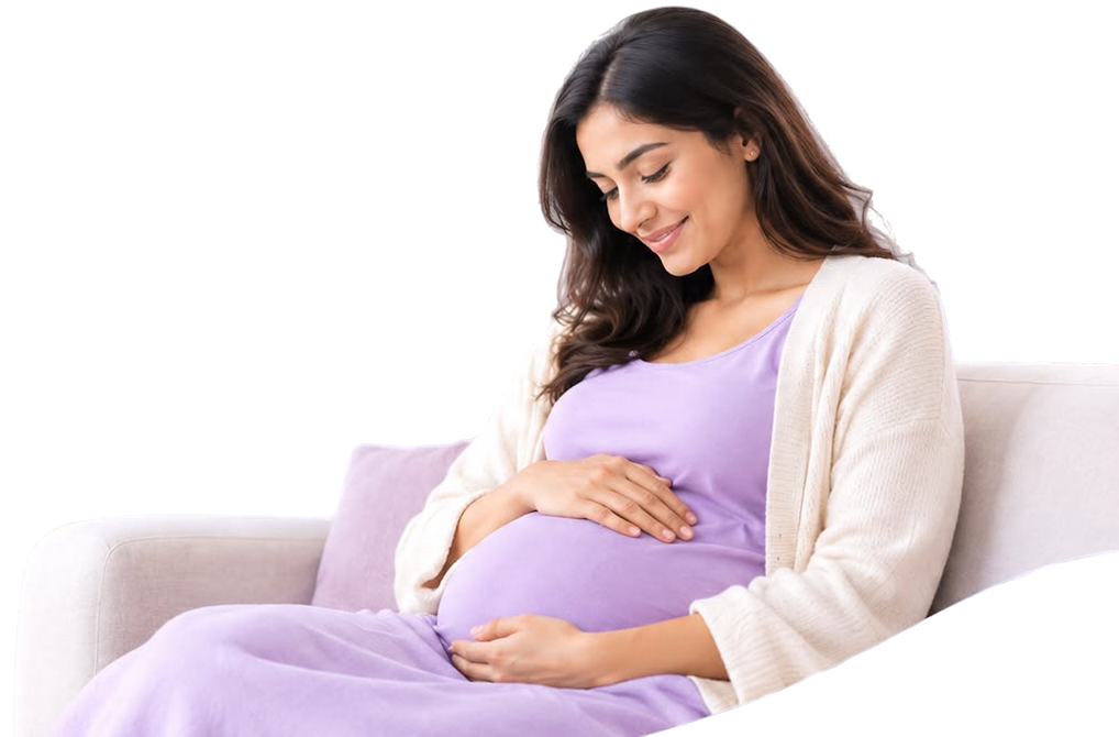 Expectant mother resting on a sofa with her hands on her belly
